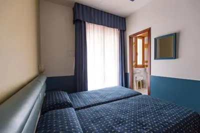 Letto o letti in una camera di Hotel Christian