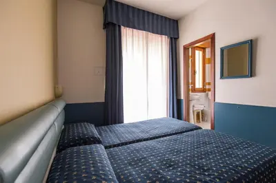 Letto o letti in una camera di Hotel Christian