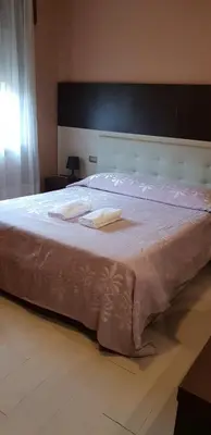 Letto o letti in una camera di Hotel Colombo