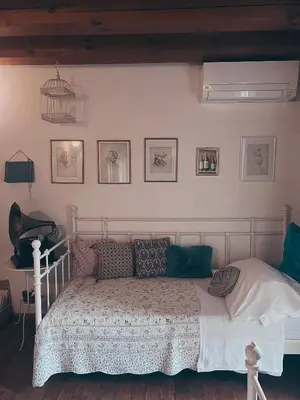 Letto o letti in una camera di Locanda San Tomaso