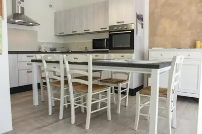 Cucina o angolo cottura di B&B L'arte è di casa