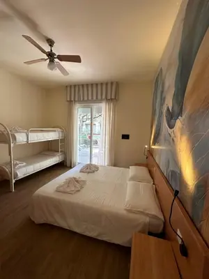 Letto o letti in una camera di Hotel La Maison