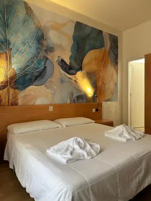 Letto o letti in una camera di Hotel La Maison