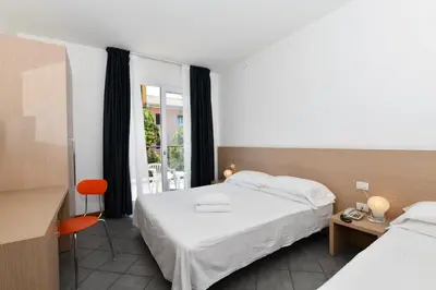 Letto o letti in una camera di Hotel Eden