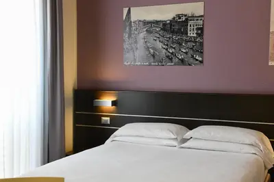Letto o letti in una camera di Hotel Vienna