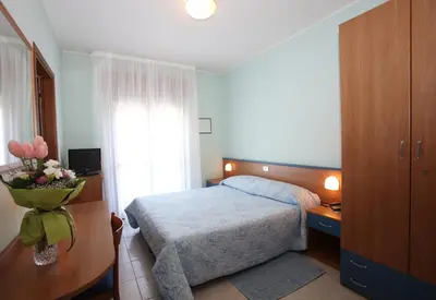 Letto o letti in una camera di Albergo Ridente