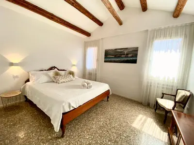 Letto o letti in una camera di Ca’ degli Oresi