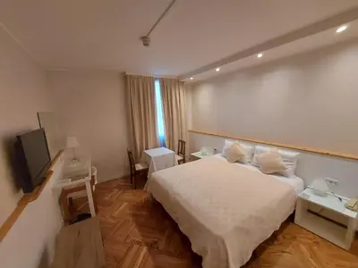 Letto o letti in una camera di Hotel Posta 77