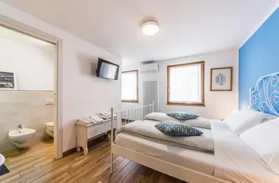 Letto o letti in una camera di LA LOGGETTA - locazione turistica