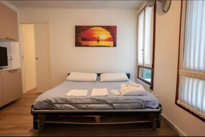 Letto o letti in una camera di VicenzaHoliday Frasche