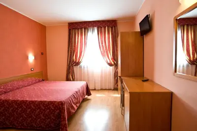 Letto o letti in una camera di Hotel Colombo