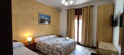 Letto o letti in una camera di The Caponi Bros