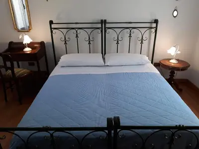 Letto o letti in una camera di San Barnaba Artist's district house