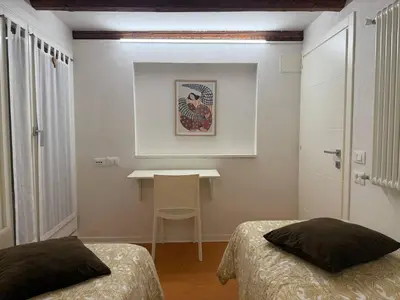 Letto o letti in una camera di Vittoria Serene Home - Heart of Venice