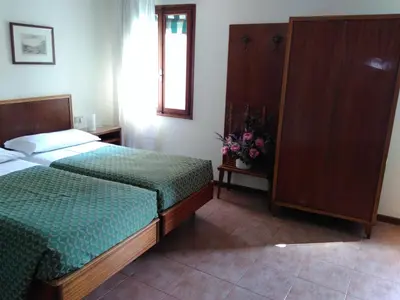 Letto o letti in una camera di Albergo Al Gobbo
