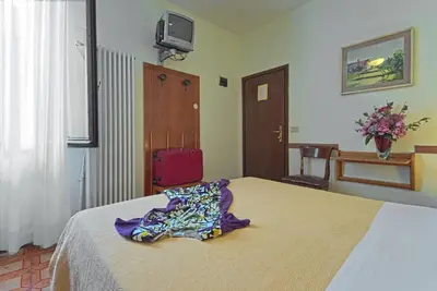 Letto o letti in una camera di Albergo Al Gobbo