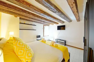 Letto o letti in una camera di Calle dei Fabbri San Marco Apartment