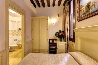 Letto o letti in una camera di Palazzo La Scala