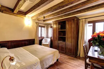 Letto o letti in una camera di Palazzo La Scala