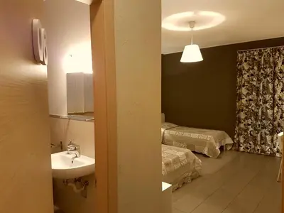 Letto o letti in una camera di Affittacamere Borgo Sabbionara
