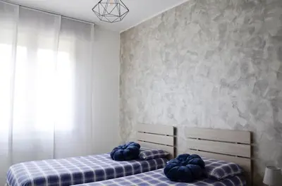 Letto o letti in una camera di Appartamento Ciclamino