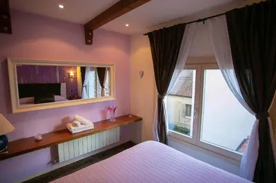 Letto o letti in una camera di B&B La Corte