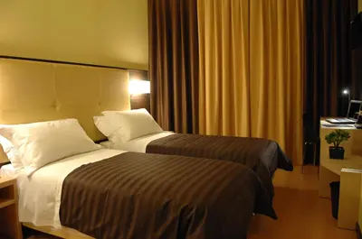 Letto o letti in una camera di Hotel Alverì