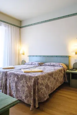 Letto o letti in una camera di Hotel Montecarlo