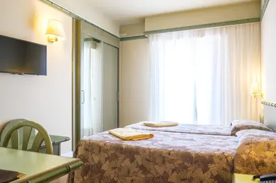 Letto o letti in una camera di Hotel Montecarlo