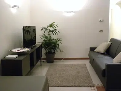 Area soggiorno di Portico Oscuro Deluxe Apartment - centro città