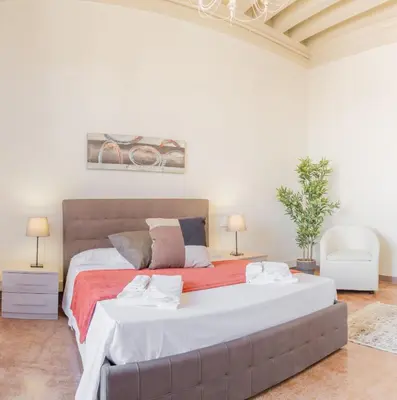 Letto o letti in una camera di Riva Palace Apartments by Wonderful Italy