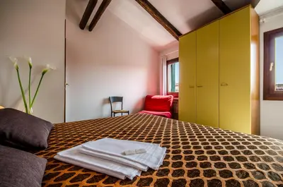 Letto o letti in una camera di Venice Apartments