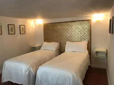 Letto o letti in una camera di Suites alla Maddalena