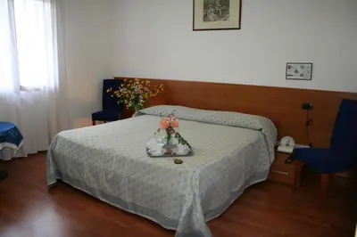 Letto o letti in una camera di Rometta Hotel