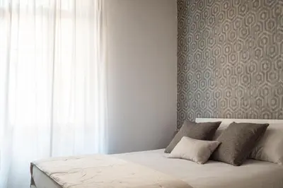 Letto o letti in una camera di Erbaria Boutique Apartment R&R