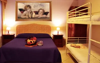 Letto o letti in una camera di Art Dreams Apartment Teatro Italia