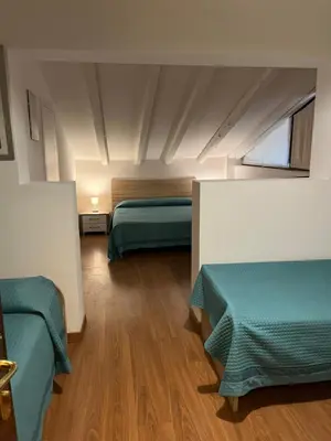 Letto o letti in una camera di Hotel Antica Fenice