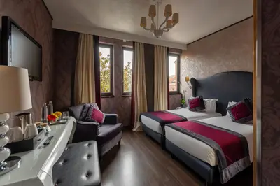 Letto o letti in una camera di Carnival Palace - Venice Collection