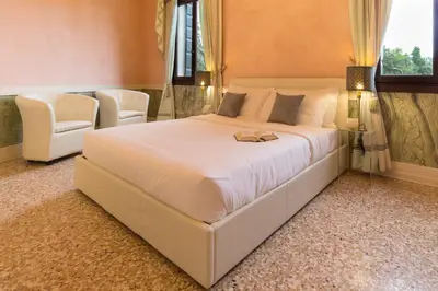 Letto o letti in una camera di Villa Volpi