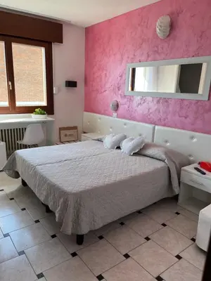Letto o letti in una camera di Hotel Touring