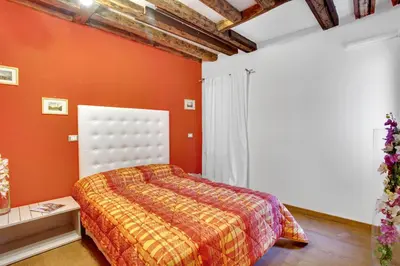 Letto o letti in una camera di Fenix Otello Apartments