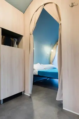 Letto o letti in una camera di GoOutside Venezia