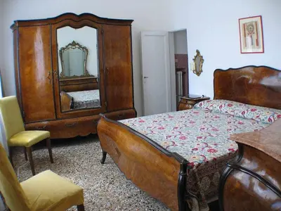Letto o letti in una camera di Laura