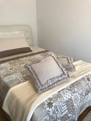 Letto o letti in una camera di Casa Martini Abano