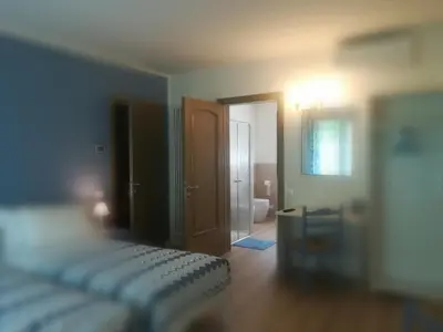 Letto o letti in una camera di La Libellula