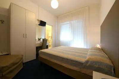Letto o letti in una camera di Hotel Savoia