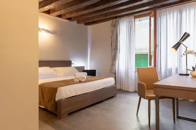 Letto o letti in una camera di Il Pozzo Magico
