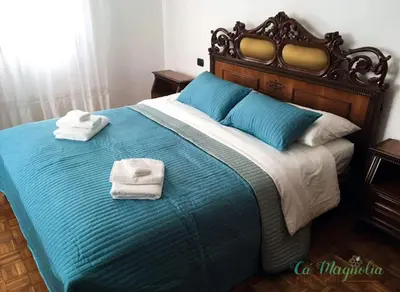 Letto o letti in una camera di Ca'Magnolia
