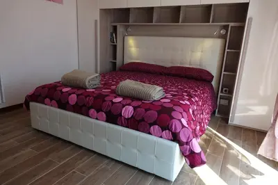 Letto o letti in una camera di PrimoPiano - Venezia Lido