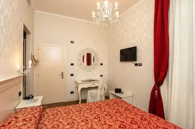 Letto o letti in una camera di Charming Palace Santa Fosca